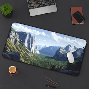 May include: A large desk mat with a scenic image of a mountain valley. The image features a large, rocky mountain range in the background, with a lush green forest in the foreground. The mat is black and has a smooth, non-slip surface.