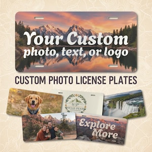 May include: Custom photo license plates with various designs. One plate features a mountain landscape with the text "Your Custom photo, text, or logo." Other plates showcase a dog, a family photo, a waterfall, and the text "Explore More."