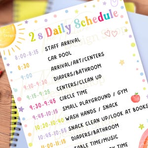 May include: A colorful daily schedule for a preschool classroom, featuring a rainbow and apple illustration. The schedule includes times for staff arrival, circle time, snack, and dismissal. The text reads "2's Daily Schedule".