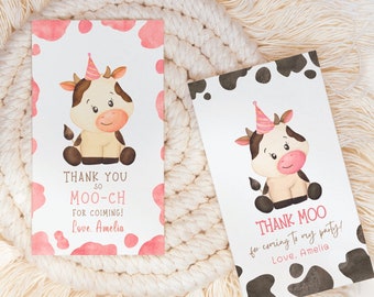 May include: Two thank you cards featuring a cartoon cow wearing a party hat. The first card has a pink background with white polka dots and the text "Thank you so moo-ch for coming! Love, Amelia". The second card has a black and white background with white polka dots and the text "Thank moo for coming to my party! Love, Amelia".
