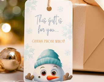 May include: A white gift tag with a blue and white snowman illustration. The tag says "This gift is for you... Guess from who?"