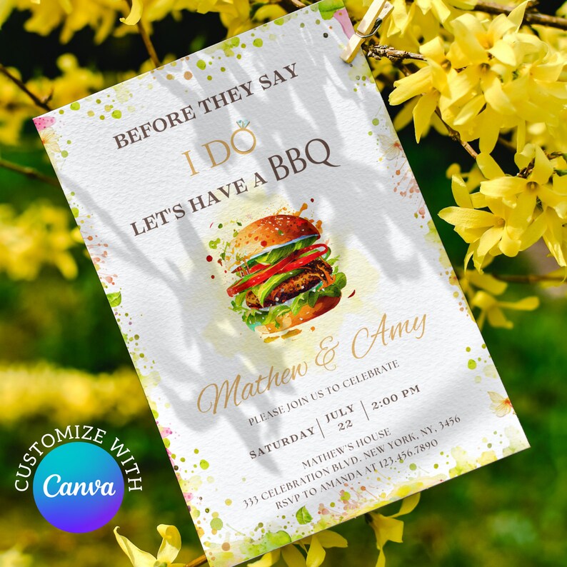 May include: A white invitation with watercolor splatters in shades of pink, green, and blue. The invitation features a cartoon burger with a gold ring on top and the text "Before they say I do, let's have a BBQ". The invitation is for Mathew and Amy's wedding celebration on Saturday, July 22nd at 2:00 PM. The address is 333 Celebration Blvd, New York, NY, 3456. RSVP to Amanda at 123.456.7890.