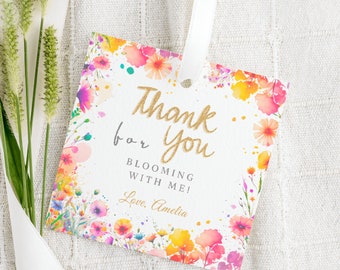 May include: A white thank you tag with a watercolor floral border in shades of pink, orange, and yellow. The text reads "Thank you for blooming with me! Love, Amelia".