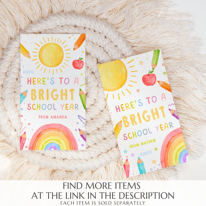 May include: Two printable cards with a watercolor illustration of a sun, rainbow, pencils, and an apple. The text on the cards reads "Here's to a bright school year" with a space for a name.