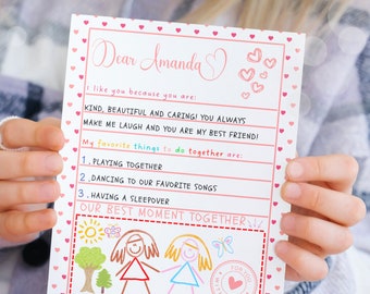 May include: A pink and white printable Valentine's Day letter template with a hand-drawn illustration of two girls holding hands. The text reads "Dear Amanda" and "Our Best Moment Together".