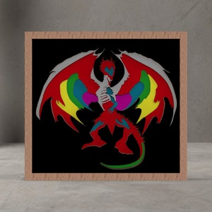 May include: A framed artwork featuring a colorful dragon illustration. The dragon has red, yellow, blue, and green wings against a black background. The frame is made of light brown wood.