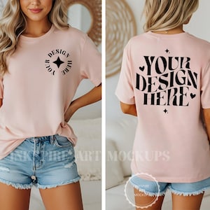 May include: A pale pink t-shirt featuring the text "YOUR DESIGN HERE" on the back and a circular design on the front. The front design includes the words "YOUR DESIGN HERE" and a star. The model is wearing denim shorts.