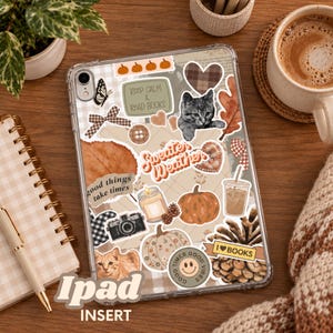 May include: A clear tablet case decorated with various autumn-themed stickers including a gray kitten, a pumpkin, a pinecone, a candle, a camera, a coffee cup, and the text phrases Keep Calm & Read Books, Sweater Weather, and I Love Books.