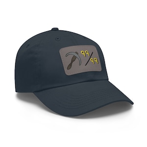 May include: A navy blue baseball cap with a gray patch featuring a pickaxe and the text "99/99".