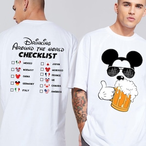 May include: White t-shirt with a black and white illustration of Mickey Mouse wearing sunglasses and holding a beer. The text "Drinking Around the World Checklist" is printed on the back of the shirt with a list of countries and flags.