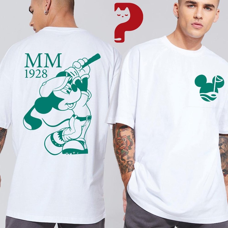 May include: White t-shirts with green graphics. One shirt features a green Mickey Mouse design with the text "MM 1928" on the back. The other shirt has a green Mickey Mouse head design on the pocket.