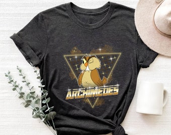 May include: A dark gray t-shirt with a retro-style graphic of Archimedes the owl from Disney's Fantasia. The owl is in a gold triangle with a glittery background.
