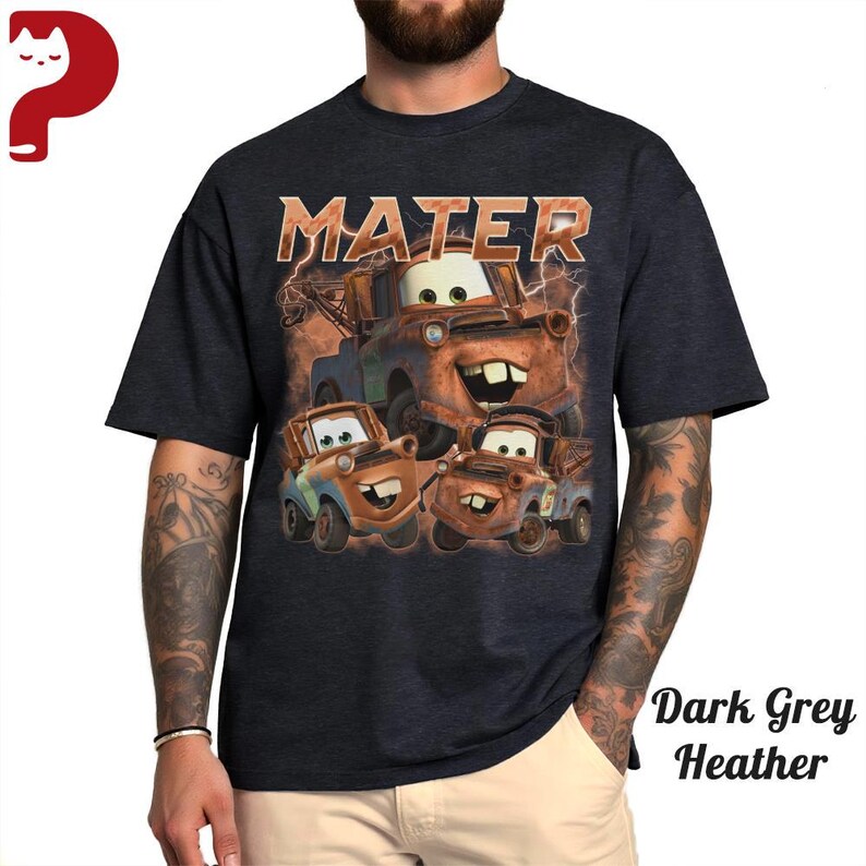 May include: Dark grey heather t-shirt featuring a graphic of the character Mater from the animated movie Cars. The word "MATER" is printed above the image in a distressed font. The image shows Mater and two other similar characters.