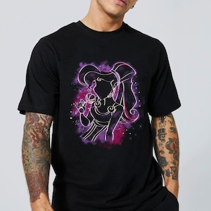 May include: Black t-shirt with a purple and pink silhouette of a woman with long hair, holding a flower. The silhouette is surrounded by a purple and pink nebula-like design.