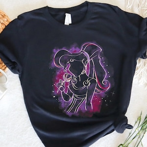 May include: Black t-shirt with a purple and pink silhouette of a woman with long hair, holding a flower. The silhouette is surrounded by a galaxy-like background.