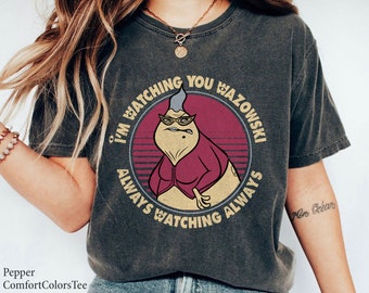 May include: A dark grey t-shirt with a vintage-style graphic of a cartoon character with the text "I'm watching you Wazowski always watching always".