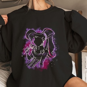 May include: Black sweatshirt with a purple and pink silhouette of a woman with long hair, holding a flower. The woman is surrounded by a purple and pink nebula.