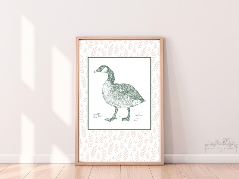 May include: A framed print of a vintage illustration of a goose with a green and white pattern background.