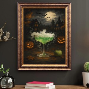 May include: A framed Halloween-themed artwork depicts a green cocktail with smoke, two jack-o'-lanterns, a green apple, and a spooky town under a full moon. The artwork is in a brown ornate frame.