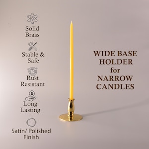 May include: A polished gold-tone brass candle holder with a wide circular base holding a single tall yellow taper candle. Text on the image reads: WIDE BASE HOLDER for NARROW CANDLES, Solid Brass, Stable & Safe, Rust Resistant, Long Lasting, Satin/ Polished Finish.