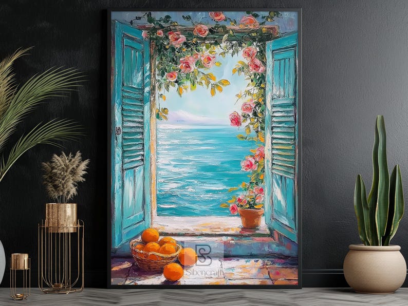 May include: A framed painting shows a coastal scene with open turquoise shutters. Pink roses surround the window, overlooking the sea. A basket of oranges sits on a stone ledge. A potted plant is on the right.