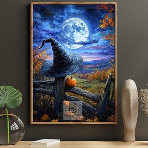 May include: A framed wall art print depicting a dark blue night sky with a large full moon, a black pointed witch hat resting on a wooden fence, and an orange pumpkin. The landscape features autumn foliage, rolling hills, and a wooden fence.