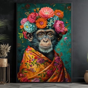 May include: A framed art print depicting a chimpanzee adorned with a colourful floral crown and a shawl decorated with roses. The artwork has a teal background with floral patterns. The chimpanzee's face is detailed, and the overall style is artistic and decorative.