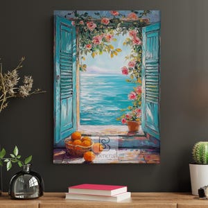 May include: A canvas print shows a coastal scene through turquoise shutters with pink roses. A basket of oranges sits on the windowsill. The artwork evokes a Mediterranean aesthetic, with a bright blue sea and sky.