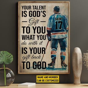 May include: A motivational poster featuring a hockey player wearing a blue and white jersey with the number 17 and the word "SAINT" on the back. The poster has the text "YOUR TALENT IS GOD'S - Gift TO YOU WHAT YOU do with it IS YOUR gift back TO GOD" and "NAME AND NUMBER CAN BE CUSTOMIZED".