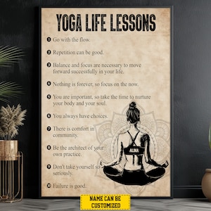 May include: A motivational poster with a black and white illustration of a woman meditating in a lotus position. The poster has a beige background with the text "YOGA LIFE LESSONS" in black at the top. The poster lists ten life lessons related to yoga, including "Go with the flow", "Repetition can be good", and "Failure is good". The poster also includes the name "ALINA" in a circle above the woman's head.