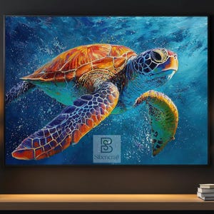 May include: A colourful painting of a sea turtle underwater. The turtle's shell features orange, brown, and blue hues. The artwork is framed and displayed on a wooden surface.