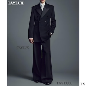 May include: A black double-breasted suit with wide-leg trousers. The suit features a satin lapel and a white shirt with a tie. The brand name "TAYLUX" is visible in the image.