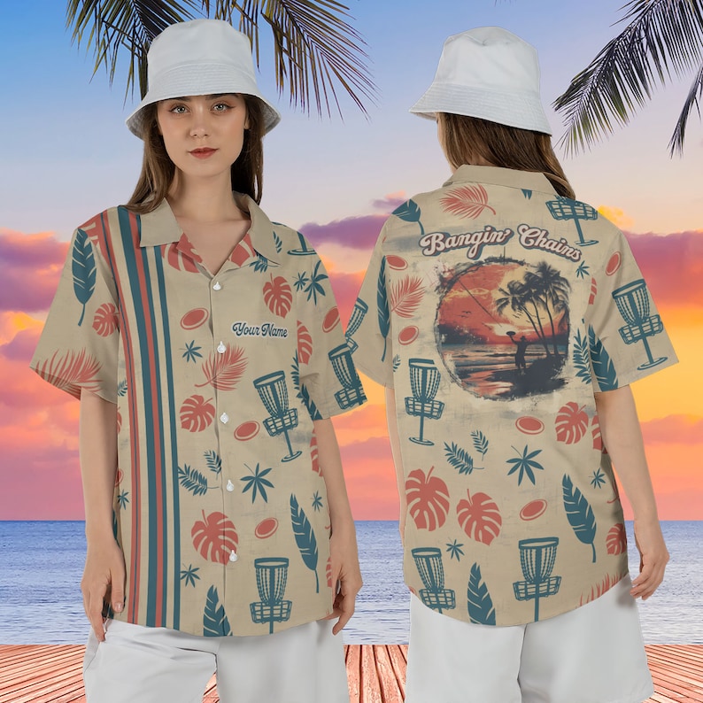 May include: A beige button-up shirt with a tropical print featuring palm trees, leaves, and disc golf discs. The back of the shirt has a sunset scene with a disc golfer and the text "Bangin' Chains". The front of the shirt has the text "Your Name".