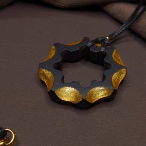 Carved ebony wood and 24K gold leaf necklace – Oculus