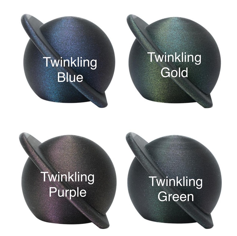 May include: Four small, round, black, iridescent planets with a silver ring around the middle. Each planet has a different color: blue, gold, purple, and green. The text "Twinkling" is written on each planet, followed by the color name.
