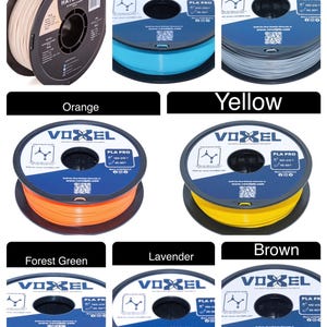 May include: Assortment of 10 spools of filament for 3D printing in various colors, including beige, sky blue, silver, orange, yellow, forest green, lavender, and brown. Each spool is labeled "VOXEL PLA PRO" and features a QR code.