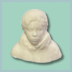May include: A white 3D printed bust of a person with short hair. The bust is a simple representation of a person's head and shoulders.