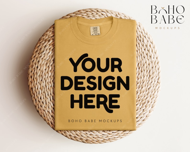 May include: A mustard yellow t-shirt with the text "YOUR DESIGN HERE" in black on a woven wicker background. The text "BOHO BABE MOCKUPS" is also visible on the t-shirt.