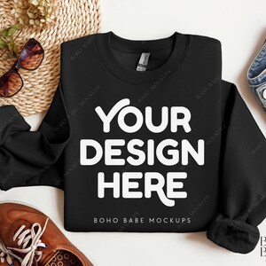 May include: Black sweatshirt mockup with the text "YOUR DESIGN HERE" and "BOHO BABE MOCKUPS" printed on the front.