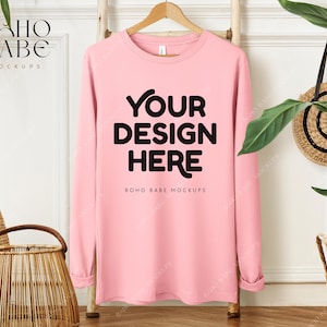May include: Pink long-sleeve sweatshirt mockup with the text "Your Design Here" and "Boho Babe Mockups" printed on the front.