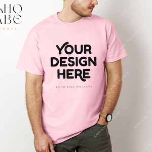 May include: A pink t-shirt mockup with the text "YOUR DESIGN HERE" and "BOHO BABE MOCKUPS" printed on the front.