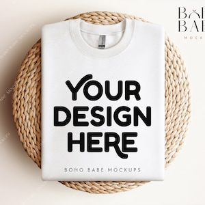 May include: White t-shirt mockup with the text "YOUR DESIGN HERE" on a woven straw mat. The text "BOHO BABE MOCKUPS" is at the bottom of the shirt.