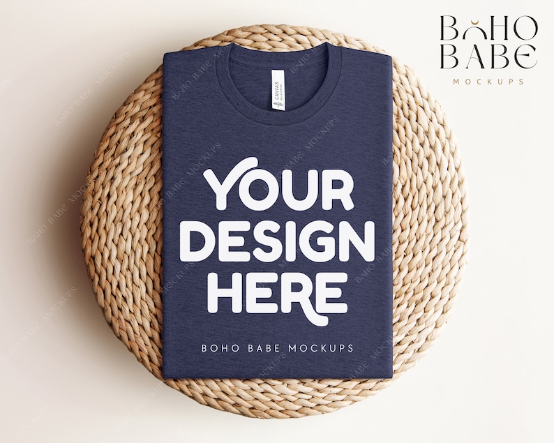 May include: A navy blue t-shirt mockup with the text "YOUR DESIGN HERE" in white on a woven straw mat. The text "BOHO BABE MOCKUPS" is also visible on the shirt.