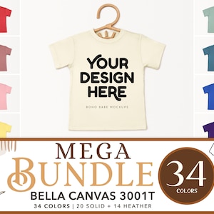 May include: A mockup of a Bella Canvas 3001T t-shirt in a variety of colors. The t-shirt is on a hanger and has the text "YOUR DESIGN HERE" and "BOHO BABE MOCKUPS" printed on it. The image also includes the text "MEGA BUNDLE 34 COLORS".