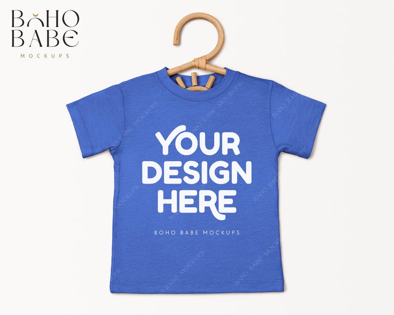 May include: A blue t-shirt mockup with the text "YOUR DESIGN HERE" and "BOHO BABE MOCKUPS" printed on the front.