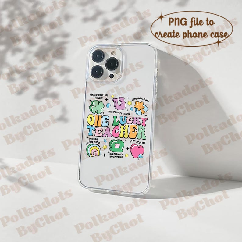 May include: A clear phone case with a colourful design featuring the text "One Lucky Teacher" and various illustrations of clovers, rainbows, stars, and hearts.