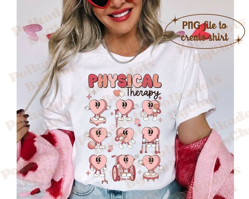 May include: White t-shirt featuring the words "PHYSICAL Therapy" in pink and peach lettering, with heart-shaped characters demonstrating physical therapy exercises. The design includes hearts with arms and legs, some using crutches or wheelchairs.