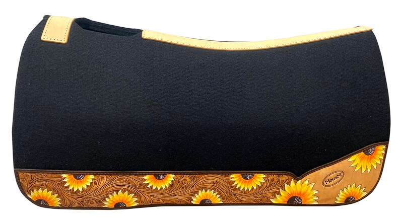 May include: Black saddle pad with a tan leather trim and sunflower design. The pad has a brown leather border with a sunflower pattern and the word "MAVERICK" in white.