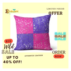 May include: A pink and purple cowhide pillow with silver accents. The pillow is on sale for up to 40% off. The text "BIG Wild SALE UP TO 40% OFF!" is in the image. The text "AUTHENTIC LEATHER" is in the image. The text "LIMITED PERIOD OFFER" is in the image. The text "SALE SALE SALE" is in the image. The text "ORDER NOW" is in the image.