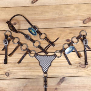 Headstall and Breast Collar tack Set decorated  with specially designed engraved Rings, leather braiding, gladiator style finish line print
